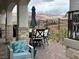 Covered patio with an outdoor seating area and mountain views at 12 Tatahatso Point St, Henderson, NV 89011
