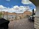 Brick patio features outdoor seating with scenic views of the desert mountains at 12 Tatahatso Point St, Henderson, NV 89011