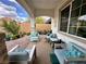 Covered patio with comfortable seating and desert views at 12 Tatahatso Point St, Henderson, NV 89011
