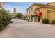 Charming street view with storefronts, landscaped walkways, and elegant architectural details at 12 Tatahatso Point St, Henderson, NV 89011