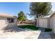 The backyard is landscaped with artificial turf and a storage shed at 1304 Virgil St, Las Vegas, NV 89110