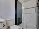 Modern bathroom with tiled shower, new toilet and quartz countertop at 1304 Virgil St, Las Vegas, NV 89110