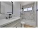 Bathroom showcasing a tub, shower with modern fixtures, and a sleek vanity at 1304 Virgil St, Las Vegas, NV 89110