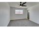 Spacious bedroom featuring a modern ceiling fan, plush carpet, and large window at 1304 Virgil St, Las Vegas, NV 89110