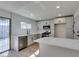 Modern kitchen featuring stainless appliances, breakfast bar and new cabinets at 1304 Virgil St, Las Vegas, NV 89110