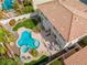 Aerial view of backyard featuring an in-ground pool, patio, lush landscaping and dining area at 1430 October Oak Ave, Las Vegas, NV 89123