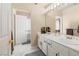 Bright bathroom featuring dual sinks, marble floors, and ample counter space at 1430 October Oak Ave, Las Vegas, NV 89123