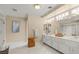 Bright bathroom featuring double sinks, marble flooring, and a shower stall with gold trim at 1430 October Oak Ave, Las Vegas, NV 89123