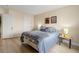 Comfortable bedroom featuring two closets, natural light, and wood-look floors at 1430 October Oak Ave, Las Vegas, NV 89123