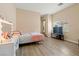 Bedroom featuring wood-look floors, a vanity, and a TV at 1430 October Oak Ave, Las Vegas, NV 89123