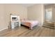 Bedroom featuring wood-look floors, a vanity, and a bed at 1430 October Oak Ave, Las Vegas, NV 89123