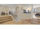 Hallway with wood flooring, stairs, and a decorative chair and vase at 1430 October Oak Ave, Las Vegas, NV 89123