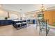 Spacious kitchen with custom blue island, stainless appliances, and adjacent dining area at 1430 October Oak Ave, Las Vegas, NV 89123