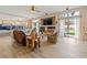 The living room boasts natural light, fireplace, and seamless access to the outdoor pool area at 1430 October Oak Ave, Las Vegas, NV 89123