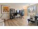 Stylish living room with wood floors, large window, modern decor, and comfortable seating at 1430 October Oak Ave, Las Vegas, NV 89123