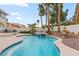 Inviting pool and spa with mature landscaping and patio seating at 1430 October Oak Ave, Las Vegas, NV 89123