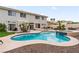 A spacious pool with integrated spa surrounded by desert landscaping at 1430 October Oak Ave, Las Vegas, NV 89123