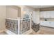 Elegant staircase with wrought iron spindles and natural light at 1430 October Oak Ave, Las Vegas, NV 89123
