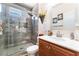 Modern bathroom showcasing a tiled shower, a large vanity mirror, and decorative accents at 150 Pocono Ranch Ave, North Las Vegas, NV 89031
