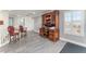 This bonus room has an ornate wood desk, leather chair, and white shutters on the windows at 150 Pocono Ranch Ave, North Las Vegas, NV 89031