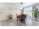 Cozy dining area featuring pendant lighting, wood floors, and plantation shutters at 150 Pocono Ranch Ave, North Las Vegas, NV 89031
