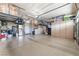 Spacious garage with epoxy floors, overhead storage, and built-in cabinets at 150 Pocono Ranch Ave, North Las Vegas, NV 89031