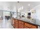The kitchen island offers sleek dark countertops, wood cabinets, and a nearby breakfast nook at 150 Pocono Ranch Ave, North Las Vegas, NV 89031
