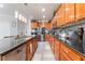 Well-lit kitchen featuring lots of counter space, stainless steel appliances, and wood finish cabinets at 150 Pocono Ranch Ave, North Las Vegas, NV 89031