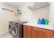 Functional laundry room with modern washer/dryer and ample storage space at 150 Pocono Ranch Ave, North Las Vegas, NV 89031
