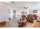 Open-concept living area features hardwood floors, neutral walls, staircase, and dining set, creating a seamless flow at 150 Pocono Ranch Ave, North Las Vegas, NV 89031