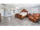Spacious main bedroom suite with a large bed, light gray walls, and wood-look flooring at 150 Pocono Ranch Ave, North Las Vegas, NV 89031
