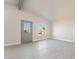 Clean, bright bedroom with wood-look flooring, recessed lighting and a view of the yard at 1720 Hassett Ave, Las Vegas, NV 89104