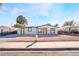 Charming home featuring a symmetrical front facade and bright yellow doors at 1720 Hassett Ave, Las Vegas, NV 89104