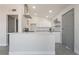 Modern eat-in kitchen features updated appliances, plenty of natural light and white cabinetry at 1720 Hassett Ave, Las Vegas, NV 89104