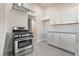 Modern kitchen featuring stainless steel appliances, white cabinetry and subway tile backsplash at 1720 Hassett Ave, Las Vegas, NV 89104