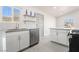 Modern kitchen featuring stainless steel appliances, white cabinetry and subway tile backsplash at 1720 Hassett Ave, Las Vegas, NV 89104