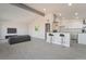 Bright, open-concept living room featuring wood-look floors and eat-in kitchen with a breakfast bar at 1720 Hassett Ave, Las Vegas, NV 89104