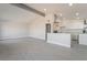 Bright, open-concept living room featuring wood-look floors and eat-in kitchen with a breakfast bar at 1720 Hassett Ave, Las Vegas, NV 89104