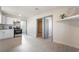 Bright living room shows doorways to kitchen and bedroom at 1720 Hassett Ave, Las Vegas, NV 89104