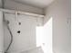 Empty room featuring hookups for laundry machines and open shelving at 1720 Hassett Ave, Las Vegas, NV 89104