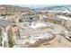 Aerial view of mountain resort buildings, snowy landscape, parking, and nearby mountainsides at 223 Hunter Ridge Rd # 300, Brian Head, UT 84719
