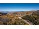 Vast aerial view of colorful mountain range, landscape, and dirt road winding through the mountainous terrain at 223 Hunter Ridge Rd # 300, Brian Head, UT 84719