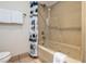 Bathroom with shower curtain, jacuzzi tub, and tile floor at 223 Hunter Ridge Rd # 300, Brian Head, UT 84719
