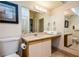 Well-lit bathroom featuring a vanity with a large mirror at 223 Hunter Ridge Rd # 300, Brian Head, UT 84719