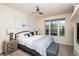 Bedroom featuring a large window, queen bed, fireplace, and bedside tables at 223 Hunter Ridge Rd # 300, Brian Head, UT 84719
