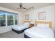 Bright bedroom with two beds, large window and wooded scenery at 223 Hunter Ridge Rd # 300, Brian Head, UT 84719