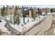 Exterior view of Cedar Breaks Lodge with snowy landscape and road at 223 Hunter Ridge Rd # 300, Brian Head, UT 84719