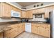 Light and bright kitchen with modern appliances and wood cabinets at 223 Hunter Ridge Rd # 300, Brian Head, UT 84719