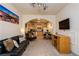 Living room with an open archway into kitchen, neutral walls, carpet, and TV at 223 Hunter Ridge Rd # 300, Brian Head, UT 84719