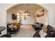 Open living room with archway into kitchen, sofa and chairs, neutral walls and carpet at 223 Hunter Ridge Rd # 300, Brian Head, UT 84719